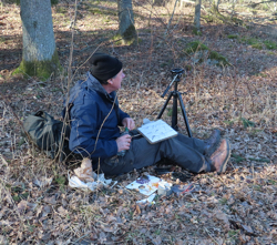 John sketching in a woodland